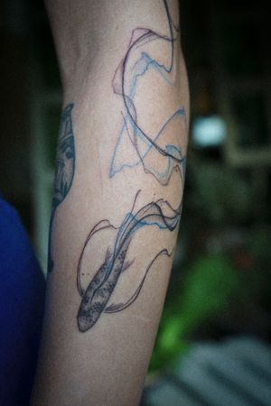 𝙄𝙂: 𝙣𝙖𝙩𝙚_𝙩𝙝𝙖𝙞𝙡𝙖𝙣𝙙 🍃 Koi fish tattoo with abstract flowing tail by Baan Khagee Tattoo Chiang Mai, Thailand at Baan Khagee Tattoo in Chiang Mai