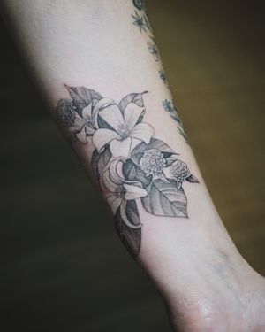 𝙄𝙂: 𝙣𝙖𝙩𝙚_𝙩𝙝𝙖𝙞𝙡𝙖𝙣𝙙 🍃 Fine line Orange jasmine and Globe amaranth flowers tattoo by Baan Khagee Tattoo Chiang Mai, Thailand at Baan Khagee Tattoo in Chiang Mai