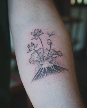 𝙄𝙂: 𝙣𝙖𝙩𝙚_𝙩𝙝𝙖𝙞𝙡𝙖𝙣𝙙 🍃 Fine line erupting volcano with lotus flowers tattoo by Baan Khagee Tattoo Chiang Mai, Thailand at Baan Khagee Tattoo in Chiang Mai