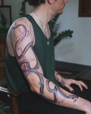 𝙄𝙂: 𝙣𝙖𝙩𝙚_𝙩𝙝𝙖𝙞𝙡𝙖𝙣𝙙 🍃 Full sleeve Majestic flowing Thai Naga tattoo by a Thai tattooist in Chiang Mai, Thailand at Baan Khagee Tattoo in Chiang Mai