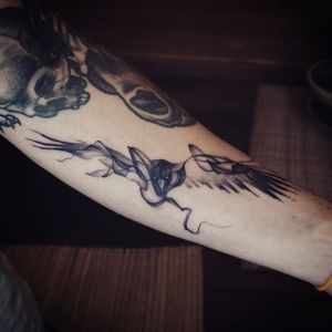 𝙄𝙂: 𝙣𝙖𝙩𝙚_𝙩𝙝𝙖𝙞𝙡𝙖𝙣𝙙 🌿 Abstract blackwork crow tattoo at Baan Khagee Tattoo Chiang Mai, Thailand at Baan Khagee Tattoo in Chiang Mai