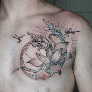 𝙄𝙂: 𝙣𝙖𝙩𝙚_𝙩𝙝𝙖𝙞𝙡𝙖𝙣𝙙 🌿 Ethereal Naga tattoo with lotus flower and dragonflies and Thai art at Baan Khagee Tattoo Chiang Mai, Thailand at Baan Khagee Tattoo in Chiang Mai