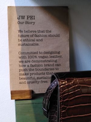 Range of JW PEI bags as well as food and household goods in shop. at Nourish in Oxford