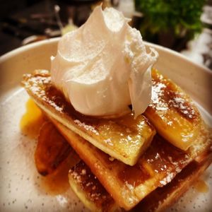 Vegan banoffee waffles with caramelised bananas and cream. at The Lord Nelson in West London