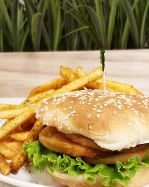 Buddy Burger with Seasoned Fries! Tender chickless patties in a homemade Teriyaki Sauce, v-mayo, lettuce...yum! at Loving Hut - E Southern Ave in Tempe