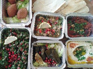 Croquettes de légumes, taboulé, aubergine fumée, feuilles de vigne, tomates et poivrons, houmous et pain at Babel in Wavre