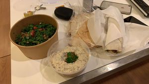 Baba ghanoush, tabouleh and falafel wrap as take away at Hummus Heads in Bangkok