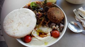 Hummus plate with pita bread, falafel, beans and salad at Hummusson in Malmo