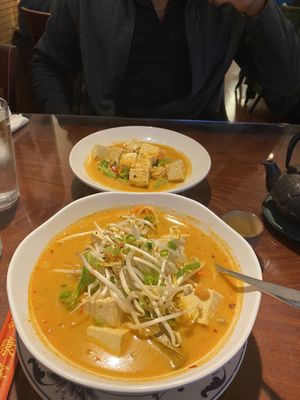 Choo chee curry (top) and Tom yum noodle soup at Singha Thai Cuisine in Moab