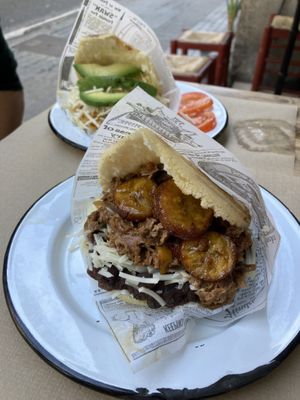Arepa with Heura ‘chicken’ (back) and seitan, black beans and plantain (front)  at Tumatey in Barcelona