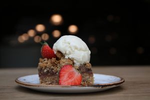 Crumble Date Cake with vanilla ice cream at Funky Fresh Cafe - DogA in Oslo