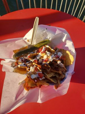 Ok, these nachos were incredible + I asked for pickles, cause pickles. Go vegan food in Chicago ♡ at Feed Your Head - Food Stand in Chicago