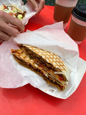Pizza crunch wrap — like a crunchy flattened hot pocket  at Feed Your Head - Food Stand in Chicago