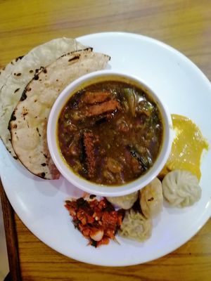 Vegan combo dish-Vegan Fish, Tofu Momo, Vegan Bread and Vegan Chhoila, at Pleased Veg & Vegan in Kathmandu