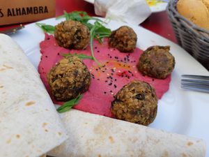 Main course (vegan): aubergine meatballs with beetroot hummus at Achuri in Madrid