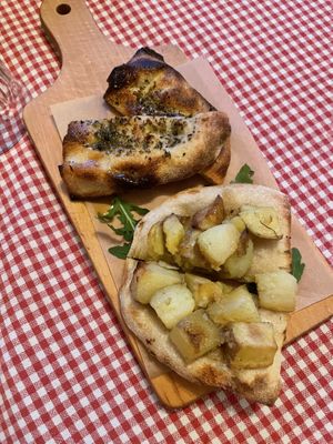 Two slices of focaccia: Aglio & oregano: garlic and oregano + Patate & Rosmarino: potatoes and rosemary  at Trevi's in Amsterdam