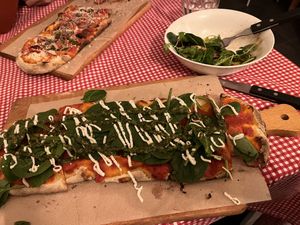 Divine pesto on pizza in the foreground. Nice insalata half eaten in bowl. “Vegetariana” vegan pizza in background.  All vegan cheese bought in.   #Veganuary at Trevi's in Amsterdam
