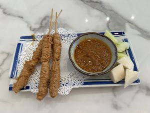 Satay chicken appetizer- soy based chicken served with peanut saucee  at Mamak Vegan Kitchen in Chamblee