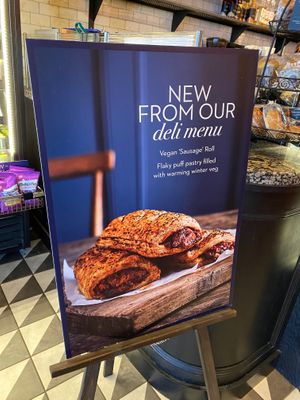 Sign advertising vegan sausage rolls  at Caffe Nero   in Ashford