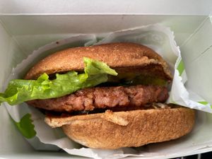 Vegan burger with a few toppings added. at BurgerFi in South Padre Island