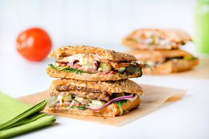 Vegan Big Stack: tempeh bacon (local & non-GMO), vegan cheese, tomato, raw red onions, organic spinach, pickles & homemade thousand island dressing on ciabatta bread. at Nature's Food Patch Market & Café in Dunedin