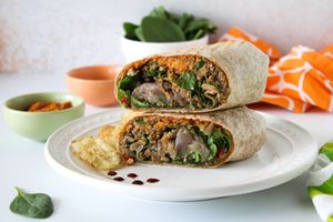 Yucatan Wrap: homemade vegan yucatan patty, homemade vegan cashew "cheese", roasted red onions, roasted red peppers, organic spinach & sweet balsamic glaze on a whole wheat wrap. at Nature's Food Patch Market & Café in Dunedin