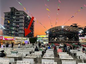 The Indian food stand is to the left of the stage, under that big red arrow (I added that so don’t look for it).  at Indian Food - Food Stall in Hua Hin
