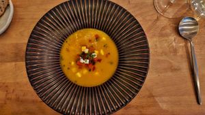 Soup with pepper, carrot, and vegan mozzarella at Kale & de Bril in Goes