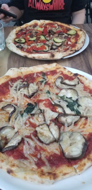 Vegan Parma pizza & Vegan Ortolana pizza at Il Forno Pizzeria in Palm Cove