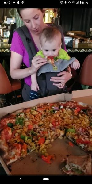 Enjoying vegan pizza!  at Rampart Treehouse in New Orleans