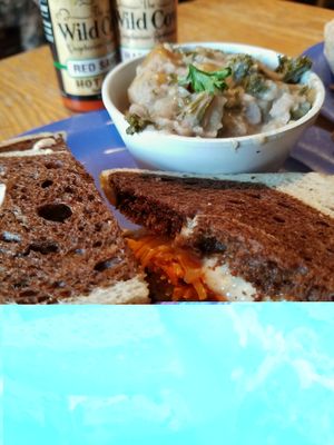 Tempeh Reuben with Vegan Cheese and the side of the day at The Wild Cow in Nashville