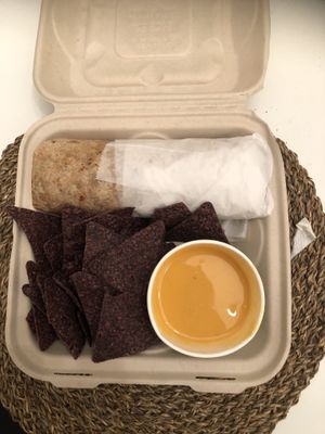 Chipotle & black bean burrito with a side of chips and queso! at The Wild Cow in Nashville