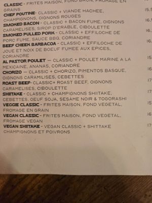 menu - 2 vegan poutines clearly indicated on menu at The Moose in Paris