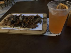 Vegan veggie pizza and aperol ginger lemon drink  at Justo 741 in Porto Alegre