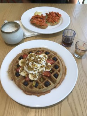 Waffle and avocado toast with carrot lox.   at Olena Cafe in Honolulu