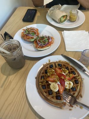 Hummus wrap, lox bagel, waffle, iced soy mocha latte  at Olena Cafe in Honolulu