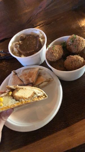 Potatoes and gravy, chicken, DFC Crunchwrap.   at Street Beet in Detroit