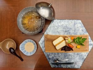 Nabe with mushroom broth, thick atsuage fried tofu and matsutake, tomato, kikurage at Ryokan Ayunosato in Hitoyoshi