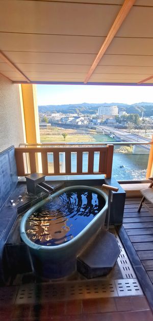 Private outdoor hot spring overlooking Kuma river. at Ryokan Ayunosato in Hitoyoshi