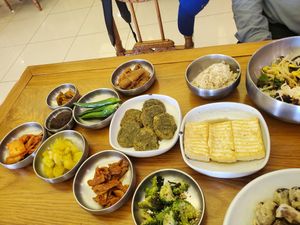 Banchan including pancakes and tofu at Puleunsolmalg Eunhyang 푸른솔맑은향 in Jeju