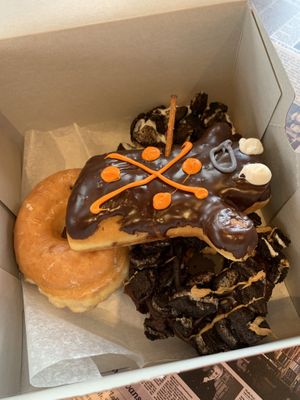 Vegan glazed, dirt, dirty old bastard, and voodoo doll  at Voodoo Doughnut - Washington Ave in Houston
