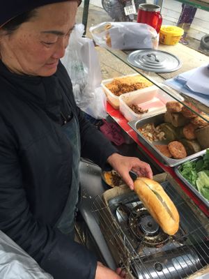 Preparing the sandwich  at Banh Mi Chay Co Hoa in Da Lat