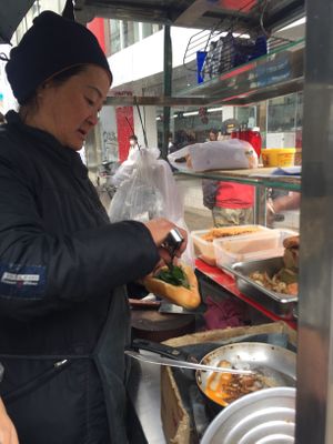 Preparing the sandwich  at Banh Mi Chay Co Hoa in Da Lat