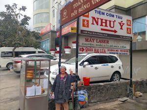 Hoa in front of her stand at Banh Mi Chay Co Hoa in Da Lat