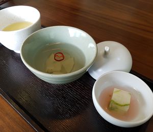 Starter:
Cucumber jelly in omija berry sirup 오미자청, pickled radish and corn porridge 
(Spring 2018) at Balwoo Gongyang - 발우공양 in Seoul