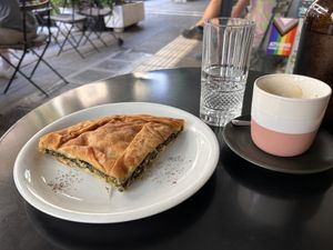 Spanakopita, coffee and waterr  at Mother Vegan Bistro in Athens