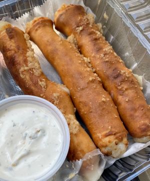 Cheesy breadsticks with a side of ranch  at Cruzer Pizza in Los Angeles