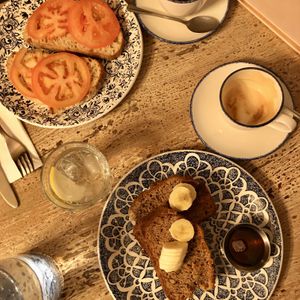 Iight breakfast of banana bread and tomato on sourdough  at Brew Coffee in Moy
