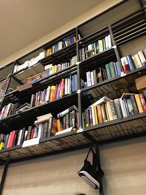 Books to read for free offered to the customers.  at Nuts Cafe in Naples