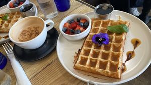 Vegan waffle with berries on the side, and a hot chai  at Met Her At A Bar in Los Angeles